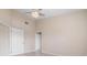 Bedroom with high ceilings and doors to hallway at 905 Addington Ct # 203, Venice, FL 34293