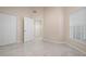 Spacious bedroom with neutral walls and tile floors at 905 Addington Ct # 203, Venice, FL 34293