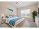 Bright bedroom with high ceilings,plant, and window shutters at 905 Addington Ct # 203, Venice, FL 34293