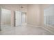 Bright bedroom with ample closet space and tile flooring at 905 Addington Ct # 203, Venice, FL 34293