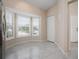 Bright breakfast nook with bay window and tile floor at 905 Addington Ct # 203, Venice, FL 34293