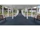 Covered walkway with benches leading to clubhouse at 905 Addington Ct # 203, Venice, FL 34293