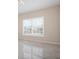 Dining room with large window and tile floor at 905 Addington Ct # 203, Venice, FL 34293