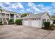 Condo building with attached garages and landscaping at 905 Addington Ct # 203, Venice, FL 34293
