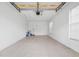 Attached garage with overhead door and ample space at 905 Addington Ct # 203, Venice, FL 34293
