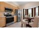 Kitchen with breakfast nook and bay window at 905 Addington Ct # 203, Venice, FL 34293