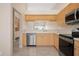 Modern kitchen with stainless steel appliances and a view at 905 Addington Ct # 203, Venice, FL 34293