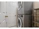 Convenient laundry room with stackable washer and dryer at 905 Addington Ct # 203, Venice, FL 34293
