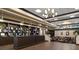 Well-lit library with ample shelving and seating area at 905 Addington Ct # 203, Venice, FL 34293