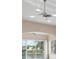 Living room with ceiling fans and sliding glass doors offering water views at 905 Addington Ct # 203, Venice, FL 34293