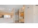 Open-concept living room featuring recessed lighting, display cabinets, and a breakfast bar at 905 Addington Ct # 203, Venice, FL 34293