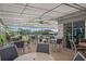 Community patio with tables and chairs under a covered area at 905 Addington Ct # 203, Venice, FL 34293