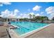 Inviting community pool with ample lounge chairs at 905 Addington Ct # 203, Venice, FL 34293