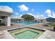 Relaxing pool and spa area with lounge chairs at 905 Addington Ct # 203, Venice, FL 34293