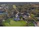 Aerial view showing community clubhouse and surrounding golf course at 9750 53Rd E Dr, Bradenton, FL 34211