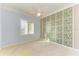 Bedroom with light blue walls, plantation shutters, and a ceiling fan at 9750 53Rd E Dr, Bradenton, FL 34211