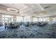 Spacious clubhouse dining area with large windows and a chandelier at 9750 53Rd E Dr, Bradenton, FL 34211