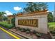Rosemont community entrance with landscaped grounds at 9750 53Rd E Dr, Bradenton, FL 34211