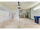 Two-car garage with overhead storage and extra shelving at 9750 53Rd E Dr, Bradenton, FL 34211