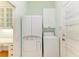 Laundry room with washer, dryer, and ample storage at 9750 53Rd E Dr, Bradenton, FL 34211