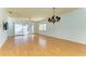 Spacious living room with hardwood floors and sliding doors to patio at 9750 53Rd E Dr, Bradenton, FL 34211