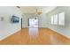Spacious living room with hardwood floors and sliding doors leading to the pool area at 9750 53Rd E Dr, Bradenton, FL 34211