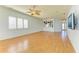 Spacious living room with hardwood floors and a ceiling fan at 9750 53Rd E Dr, Bradenton, FL 34211