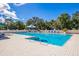 Inviting community pool with lounge chairs and umbrellas at 9750 53Rd E Dr, Bradenton, FL 34211