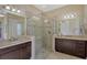 Bathroom with double vanity, large shower, and granite countertops at 1014 Overlook Ct, Bradenton, FL 34208