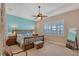 Spacious bedroom with water views and a ceiling fan at 1014 Overlook Ct, Bradenton, FL 34208