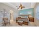 Bright bedroom with access to a walk-in closet and ceiling fan at 1014 Overlook Ct, Bradenton, FL 34208