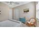 Serene bedroom with window seat and ceiling fan at 1014 Overlook Ct, Bradenton, FL 34208
