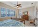 Bright bedroom with water views and a ceiling fan at 1014 Overlook Ct, Bradenton, FL 34208