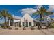 White building with a metal roof and palm trees at 1014 Overlook Ct, Bradenton, FL 34208
