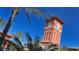 Tall clock tower with orange facade and arched details at 1014 Overlook Ct, Bradenton, FL 34208