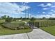 Fenced dog park with grassy area, benches, and waste disposal at 1014 Overlook Ct, Bradenton, FL 34208