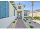 House entryway with blue shutters and brick walkway at 1014 Overlook Ct, Bradenton, FL 34208
