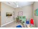 Bright home office features built-in desk, comfortable seating, and large window at 1014 Overlook Ct, Bradenton, FL 34208