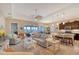 Open living room and kitchen area, featuring comfortable seating and water views at 1014 Overlook Ct, Bradenton, FL 34208