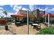 Outdoor patio with tables and chairs under a red awning at 1014 Overlook Ct, Bradenton, FL 34208