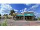 Stone-faced building with green awning and outdoor seating at 1014 Overlook Ct, Bradenton, FL 34208