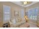 Bright sitting room with a comfortable couch and plenty of natural light at 1014 Overlook Ct, Bradenton, FL 34208