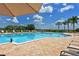 Community pool with lounge chairs and umbrellas at 1014 Overlook Ct, Bradenton, FL 34208