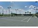Well-maintained tennis courts with ample lighting and seating at 1014 Overlook Ct, Bradenton, FL 34208