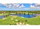 Aerial view of community with golf course and lake at 10817 Tarflower Dr # 202, Venice, FL 34293