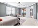 Spacious bedroom with access to a private balcony and neutral decor at 10817 Tarflower Dr # 202, Venice, FL 34293