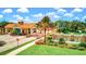Gated entrance to Sarasota National with water feature at 10817 Tarflower Dr # 202, Venice, FL 34293