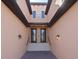 Shared entryway with brick walkway and lighting at 10817 Tarflower Dr # 202, Venice, FL 34293