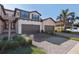 Two-story townhome with brown garage and palm trees at 10817 Tarflower Dr # 202, Venice, FL 34293