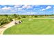 Picturesque golf course with lush greens and palm trees at 10817 Tarflower Dr # 202, Venice, FL 34293